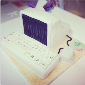 Retro computer cake with keyboard and post-it notes